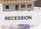 Euro and inscription recession on housing plan. House under contruction. Crisis of real estate market. Reduced housing prices