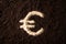 Euro logotype symbol written on brown ground