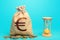 Euro money bag and hourglass. Profitability and return on investment. Time for paying taxes. Pension savings. Customer loyalty