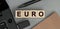 Euro - word concept from wooden blocks. Top view