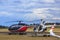 Eurocopter and Robinson helicopters at an airport