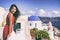 Europe Greece Santorini luxury travel vacation woman on famous santorini Oia island travel european destination. Red