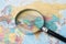 Europe, Magnifying glass close up with colorful world map, Magnifying glass close up with