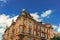 Europe medieval stone building exterior facade architecture object foreshortening from below on vivid blue sky background space in