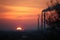 Europe. Poland. Ecology. Smoky chimneys of the factory in the sunset. Autumn 2017