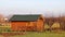 Europe. Southeast of Poland. Podcarpatian region. A small suburban wooden cottage with a metal roof. Autumn 2017