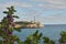 Europe, Spain, Balearic Islands, Mallorca. Porto Colom. Walkway along the waterfront. lighthouse