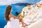 Europe summer travel destination Santorini woman