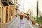 Europe travel vacation fun summer woman with arms up and hat happy in Cefalu, Italy. Carefree tourist girl in European destination