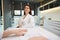 European beautiful woman in a white bathrobe talking to cosmetologist doctor, consulting about anti-aging treatment procedures, in