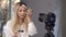 European blond beautiful makeup artist is applying powder