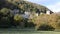 European castle on hillside establishing shot surrounded by trees for feature film, Gwrych Castle