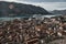 European cityscape. Top view of the rooftops of the ancient port city with orange tiles.