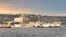 European coast of the Bosporus strait with docked ferry boats, and Dolmabahce Palace in the background, Istanbul, Turkey