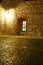 European cobbled street with lantern and window by night