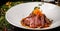 European cuisine. Marinated veal with roast Medium rare. Degree of roasting. Chef pours beef olive oil. Serving dishes