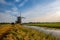 European dutch old windmill landscape with blue sky