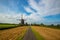 European dutch old windmill landscape with blue sky