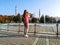 European female tourist shoots Hagia Sophia in Istanbul Turkey on a smartphone, view from the back. Slender girl in trousers and