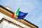 The European flag of Europe and Italian flag waving low angle view