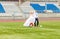 European Football Championship concept. Wedding couple on the football stadium.