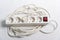 European household white extension cord for 220v with fuse on white textile