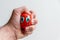 European male hand squeezing an anti-stress ball with the strong fingers shows stress and anger, anxiety and frustration