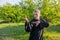 European master kung fu practicing qiqong taijiquan in the green park