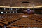 European Parliament chamber featuring an array of chairs and big screens