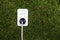 European power socket on grass. Energy concept