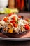 European Spanish cuisine. Baked eggplants with meat and vegetables, parmesan cheese. White wine on the table. Close-up background