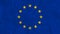 The European Union EU flag with a subtle creased fabric texture