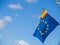 European union flag together with a spanish flag on a ship.