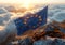 European union flag waving atop a mountain peak at sunrise, symbolizing hope and unity. stunning cloudscape backdrop. AI