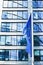 European Union flag waving in front of modern corporate office building, symbol of EU Parliament, Commission and Council