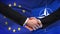 European Union and NATO handshake, international friendship, flag background