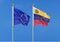 European Union vs Venezuela. Thick colored silky flags of European Union and Israel. 3D illustration on sky background. â€“