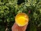 European vacation healthy breakfast food selfie. POV of man holding morning orange juice at resort villa. Turkey, Alanya