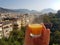 European vacation healthy breakfast food selfie. POV of man holding morning orange juice at resort villa. Turkey, Alanya