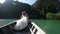 European Wedding Couple Sitting in Longtail Boat