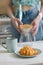 European woman brews coffee at home in her kitchen and enjoys her morning, good morning, caucasian woman makes coffee