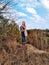 European woman on hill at spring forest