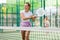 European woman padel tennis player trains on the outdoor court