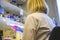 European woman scientist closely looking at the agar plate for bacterial culture growth by holding in a hand for medicinal