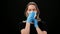 European woman wearing protective gloves putting on surgical face mask. 4k Dragon RED camera