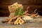 Eurycoma longifolia Jack,dried roots,green leaves and powder on an old wooden background