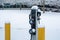 EV charging station for zero emission cars on white snow background