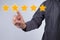 Evaluation concept. Businessman pointing five star to increase r