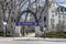 EVANSTON, IL - APRIL 3, 2020: On a normally busy school day, a lone jogger runs through the gates of an empty Northwestern