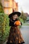 Eve of All Saints\' Day. Cute little girl portrays the evil enchantress.